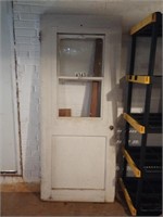 Outer wood door. Missing a glass. Approximately