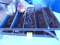 2 metal trays of nails