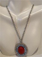 Silver necklace large red stone centered around