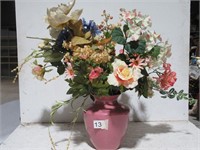 faux flower arrangement in pink vase