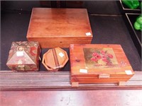 Three wooden boxes, one decorated with brass