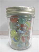 4" Tall Jar Full Of Assorted Glass Marbles