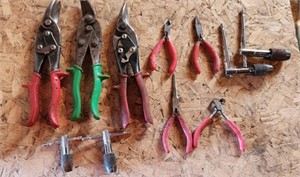 Assorted tin snips, pliers and more