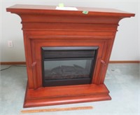 Wood framed fireplace with Dimplex heater