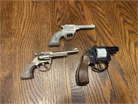 Small metal and plastic pistols decorative