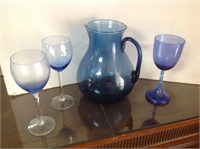18 blue wine glasses, and pitcher