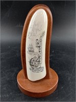 Polished scrimshawed piece of mammoth ivory in tra
