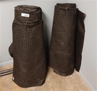 2 identical rolls of a black patterned fabric