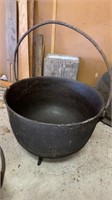 Extra large cast-iron antique kettle, with a