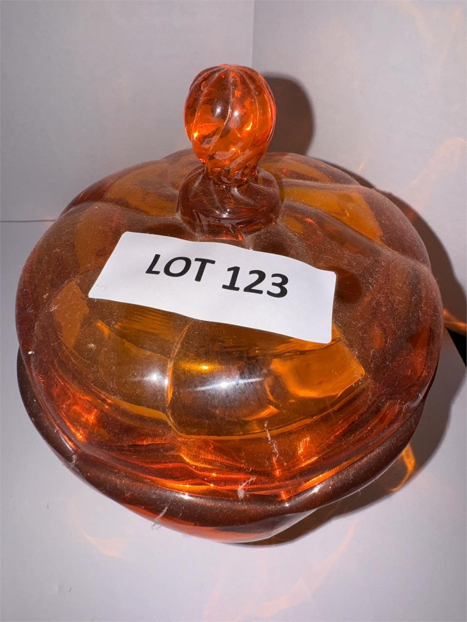 Orange candy dish on stand