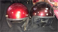 Red and maroon helmets