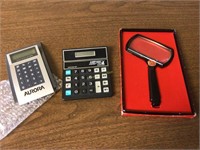 Magnifying glass and calculators