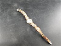 Ladies Timex watch placed on a hand made Western s