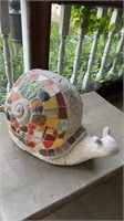 Large snail figure with shards of different