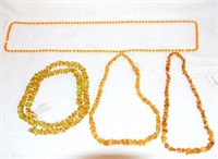 3 Amber color necklaces and 1 multi color