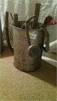 Antique gas/oil can and contents inside
