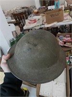 Antique army helmet inside padding is loose