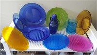 Colored glass plates, cup,and bottle,