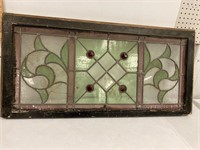 Stained glass window. Couple cracks, red gems