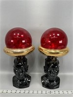 Pair of African red glass decor figures