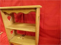 Wood shelf w/heart cut outs.