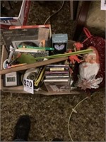 Box lot office supplies, clocks, Santa Claus  CDs