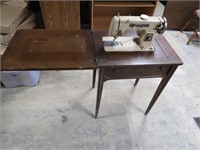 Vintage sewing machine w/table.