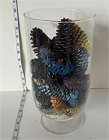 Decorative pine cones in glass jar
