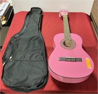 Pink child size acoustic guitar with soft case