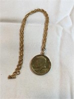 Necklace with 1977 liberty Kennedy half dollar