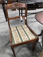 Wood chair w/ carved rose, cloth seat