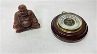 Barometer and wood carved Buddha