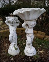 Concrete statues, one missing top. Tallest 33"