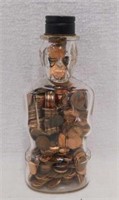 Glass Lincoln Foods bank bottle w/ pennies, 8"