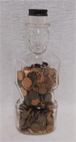 Glass Lincoln Foods bank bottle w/ pennies, 10"