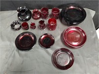Group of red glass plates, cups, vases etc.