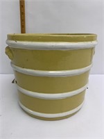 Yellow stoneware flower pot crack is pictured