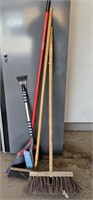 Group of brooms and snow brush