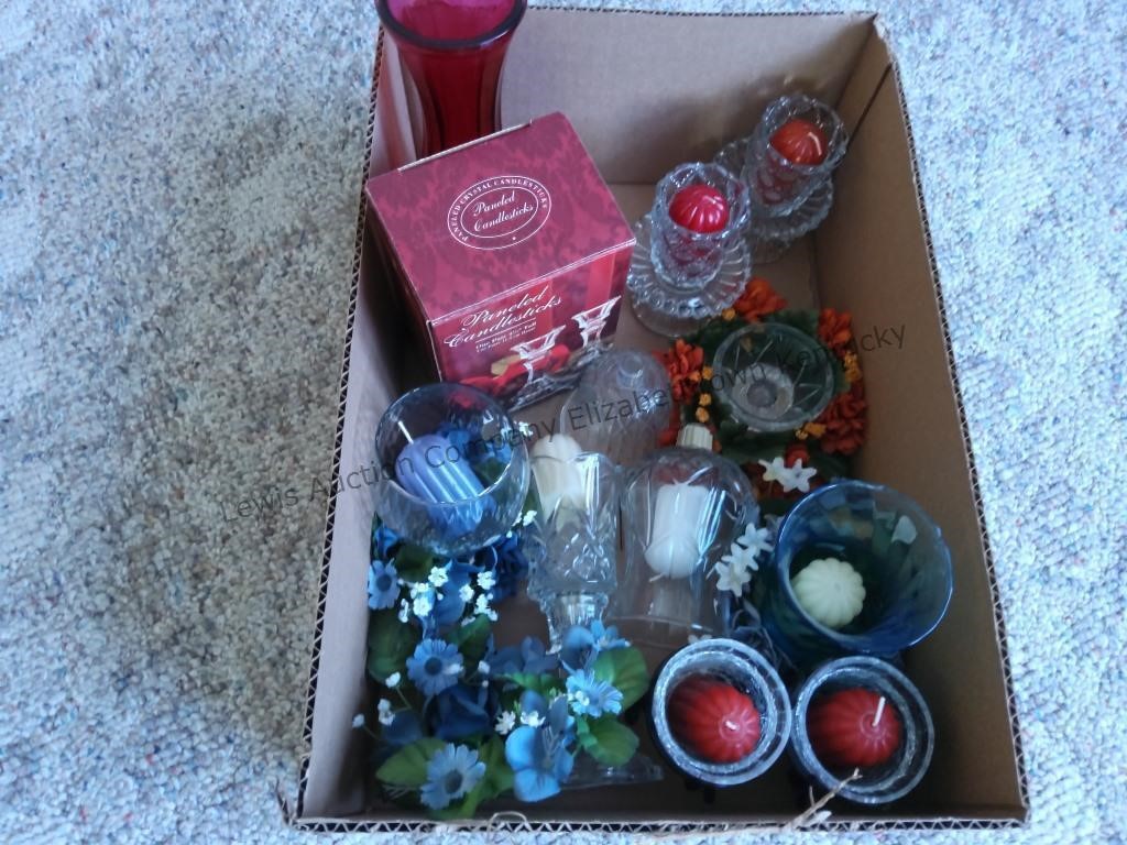 One box of home interior votive cups with candles