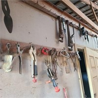 Wall of Tools by Door w/ Pipe Wrenches & Plane