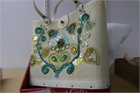 Bedazzled handbag and eyelet lace shawls