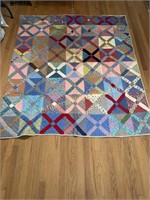 Hand stitched X quilt