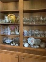 Three shelves  of assorted glassware