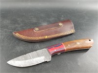 Twist Damascus bladed knife with wood scales and l