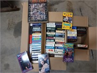 Lots of assorted VHS tapes, piano book