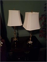 Pair of heavy brass lamps with bow top