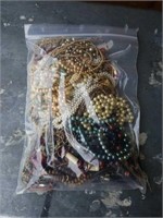 Bag of costume jewelry necklaces