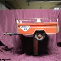 Vintage U-Haul Pedal car trailer. Sign