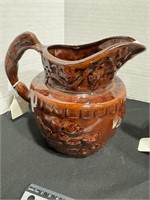 Brown pottery pitcher