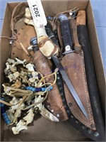 Box of knives, sheaths, bone necklace
